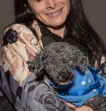 volunteer holding dog